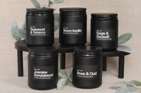 Simple and sleek all black candle design with bold white lettering. Simple scented aromas such as warm vanilla, teakwood tobacco and more.