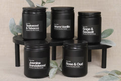 Simple and sleek all black candle design with bold white lettering. Simple scented aromas such as warm vanilla, teakwood tobacco and more.