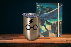 A Harry Potter Wine Tumbler with Harry's Glasses and Lightning Bolt Scar and a Harry Potter Journal.