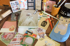 Assorted panda-themed stationery items from the Paper Overhaul subscription box, featuring notepads, stickers, and pens