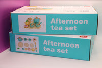 A picture of the outer packaging for the Afternoon Tea Set toy. A possible inclusion in the Toddler Toy Treasure Box.