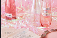 3 pink glasses, yellow napkins, pink and yellow confetti from a Uncorked Box subscription box.