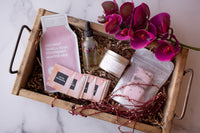 A photo presenting an assortment of skincare items, including a nourishing sheet face mask, and a relaxing scented candle.