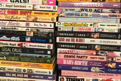 2 large stacks of manga books.