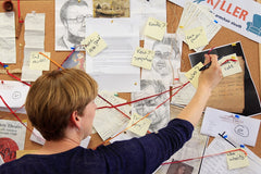 Player plots out mystery using corkboard and postit notes, pinboard shows progress of mystery so far, with documents and sketches