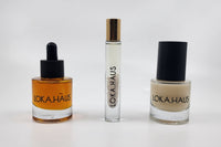 LOKA.HAUS: 'Duality Oil' in amber, center 'Intensity Parfum Roller' & right, 'Radiant Serum'. Elegance & quality shine in every drop.