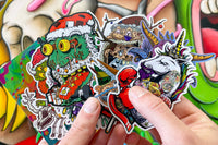 Colorful assortment of stickers from the Monthly Sticker Savages Box featuring monsters and whimsical designs for water bottle stickers