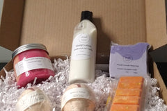 A Lavish Luxury Bath and Body Box filled with soaps, lotions, and other items.