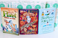 Three colorful children's books from the Kids Read Daily Book Club: "My Family and Me," "The Thrifty Guide to Ancient Rome," and "Freddie Mole, Lion Tamer"