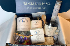 Box features a Olive Branch and Citrus Soy Candle, a bar of White Eucalyptus Mint Soap, Cashmere scented Scrub and Body Butter, Bath Salts 