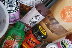 Spicy food items from around the USA featured in box. Includes hot sauce, michelada mixes, salsa macha and other spicy goods.