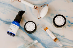 Besti wellness products such as vitamin C face toner, papaya face mask, white willow exfoliator, and antioxidant face cream.