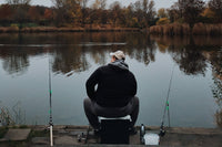 Man fishing off a dock.