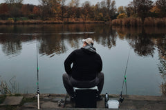Man fishing off a dock.