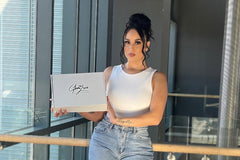 Luxe Babe (Glam Luxe Influencer) holding our brand new subscription boxes. Each box is filled with 3 fashion & beauty products.