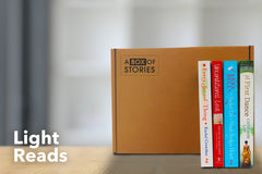 Brown subscription box filled with four light reading books, featuring charming stories and uplifting themes for easygoing book lovers.