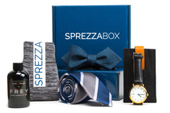 A SprezzaBox monthly subscription box featuring a watch, tie, socks, and a wooden comb for men's accessories