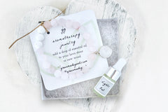 Rose Quartz Diffuser Bracelet with Clear Quartz Charm in White Gift Box with Aromatherapy Instruction Card and Lights Out Mini Oil Dropper.