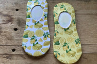 Easy peasy lemon squeezy lemon no-show socks, with white and yellow background.  Super comfortable socks you will always grab.