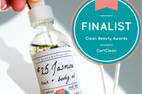 The Jasmine Hair + Body Oil by Greenmade goods with the Clean Beauty Award Seal in the right hand corner.