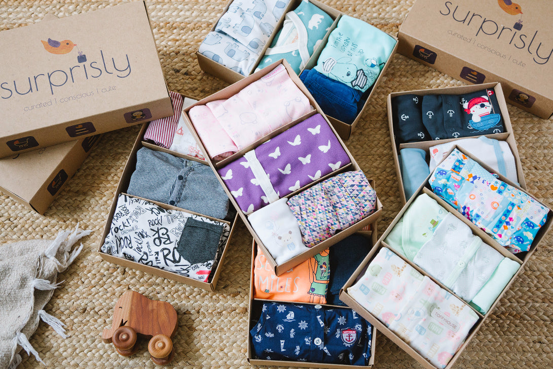 Surprisly boxes showing that each box has 3 unique outfits for little ones