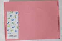 The box containing the goods is a pink box, and the shipping package will be packed in a carton or in a plastic bag.