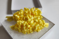 Yellow ruffle bows make you smile at the sight of them. Delightful as a sunny day. Perfect for spring summer, and fall!