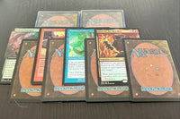 Assortment of curated rare cards and Magic: The Gathering cards from throughout Magic history against a dark background