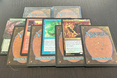 Assortment of curated rare cards and Magic: The Gathering cards from throughout Magic history against a dark background