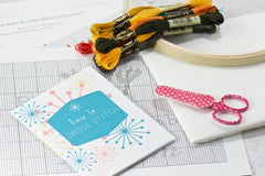 Materials in cross stitch subscription kit includes instructions & tips guide, color black/white patterns, embroidery thread, fabric