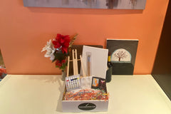 Enjoy a Paint and Sip Box or give as a gift. Each box contains an easel, a canvas, paint, a tray, and brushes. 