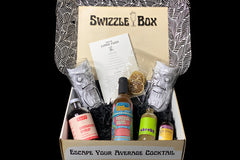The contents of our popular Zombie Punch Cocktail shown inside the box. This shows the detailed recipe card. 