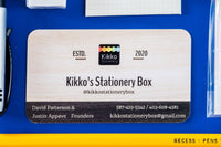 Close-up picture of notebook, pencils, stickers, pen, eraser, and business card. These items are an example of what may be included.
