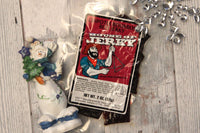 A single bag of House of Jerky Chipotle Bourbon jerky.  On a white barn wood background with a snowman and snowflake.