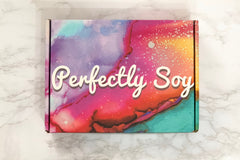 A multi-colored Perfectly Soy subscription box.