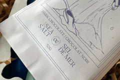 Sea salt "Cult" chocolate from the December 2023 box, featuring Masters of Atlantis by Charles Portis.