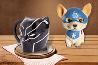 Marvel Black Panther 3D Sculpted mug and a Avengers Corgi sculpted Bobblehead sitting on a wooden table.