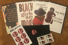 A layout with four unique note cards, sample seals, envelope and stamps on a brown furry background.