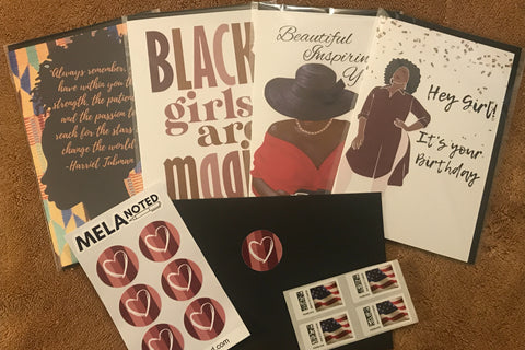 A layout with four unique note cards, sample seals, envelope and stamps on a brown furry background.