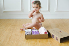 Cute baby girl with her Surprisly box