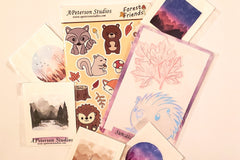 Example of what you could receive int he box. Forest Friends Sticker Sheet, Suncatcher stickers, and single vinyl stickers. 