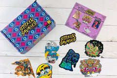 Colorful assortment of stickers from the Monthly Sticker Savages Box featuring monsters and whimsical designs for water bottle stickers