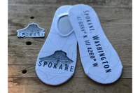 Topography background with the Spokane Pavilion and Coordinates in black, white, and grey, and coordinating sticker.