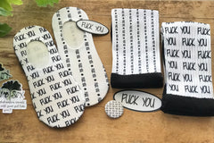 A showcase of the no-show and crew socks, with a couple goodies you will receive in your envelope.  Fun, playful, gag gift. 