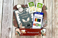 The Stress Relief Adult Coloring Book Box will include a book, an adult coloring book, colored pencils, as well as 2 - 3 self-care products.