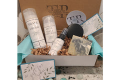 The subscription box includes an all-natural men's shave set, soap, and shampoo bar.  Lightly scented, or unscented options.
