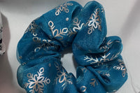 handmade scrunchies. Fabric bought from the USA and the UK. Three surprises in every box.