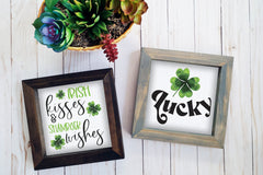 Brown and gray wood framed signs in various designs. St. Patrick's day irish kisses and shamrock wishes, lucky designs.