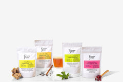 A variety of Everyday People Coffee & Tea's Great Tasting Sustainably Grown and Ethically Sourced Loose Leaf Tea Subscription, perfect for gifting, on a white background.