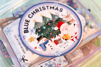 Blue Christmas slime kit label close up with Santa and snowman and cute Christmas TREES. blue ring around the label.
